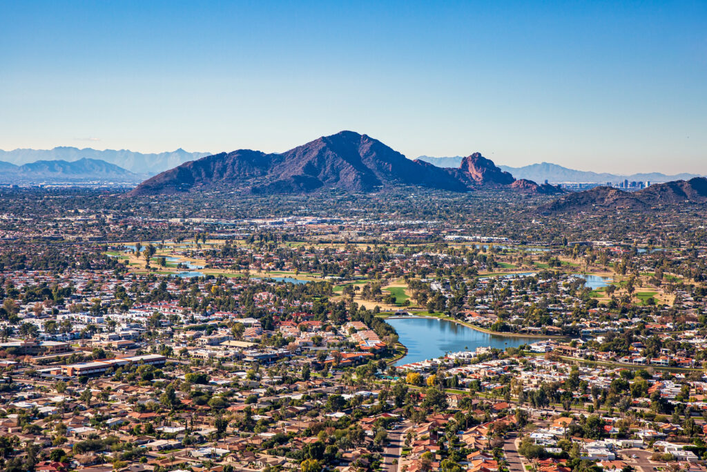 Aerial view from above Scottsdale looking SW towards Camelback Mountain and downtown Phoenix, Arizona.