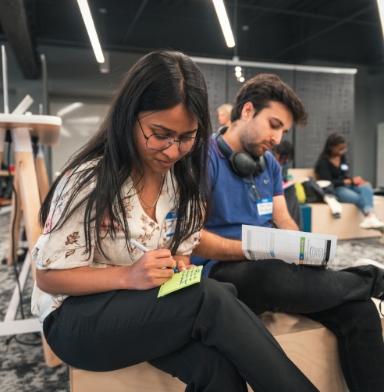 A group of students taking notes.